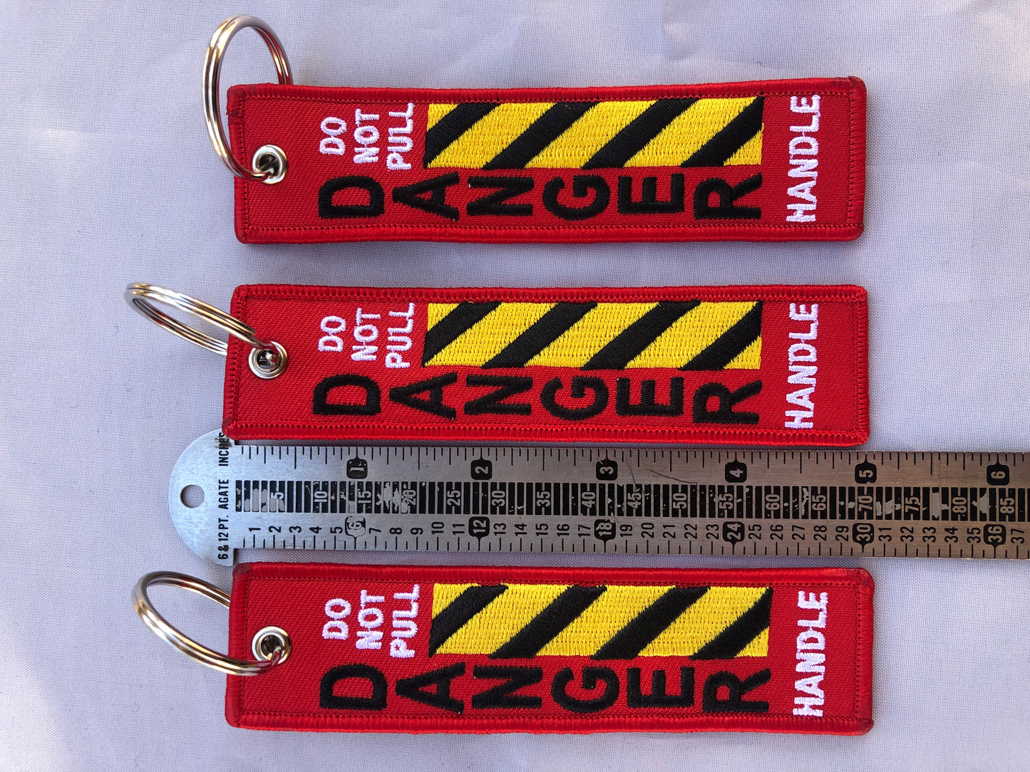 Do Not Pull Handle Danger Keychain Set Of 3