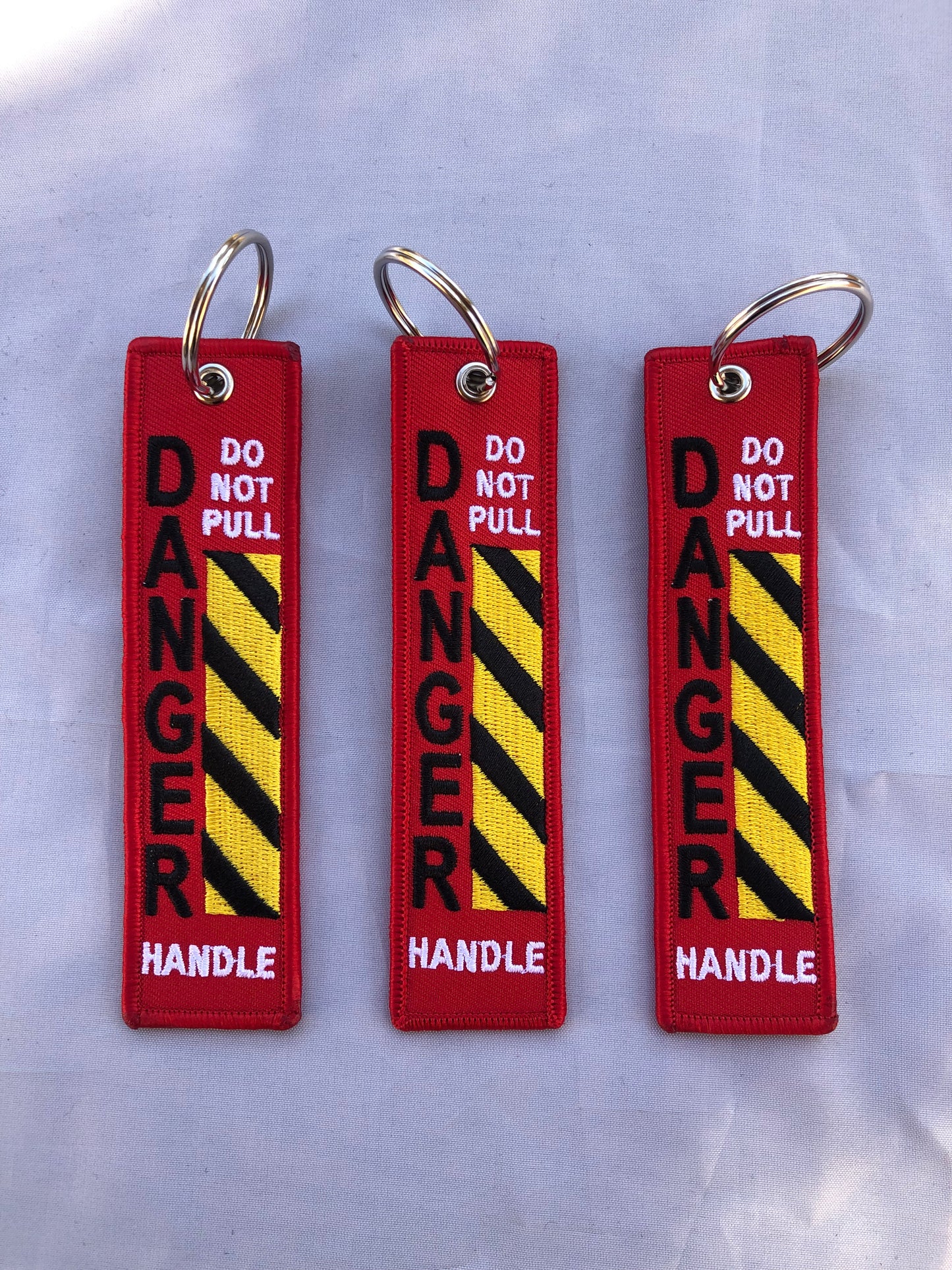 Do Not Pull Handle Danger Keychain Set Of 3