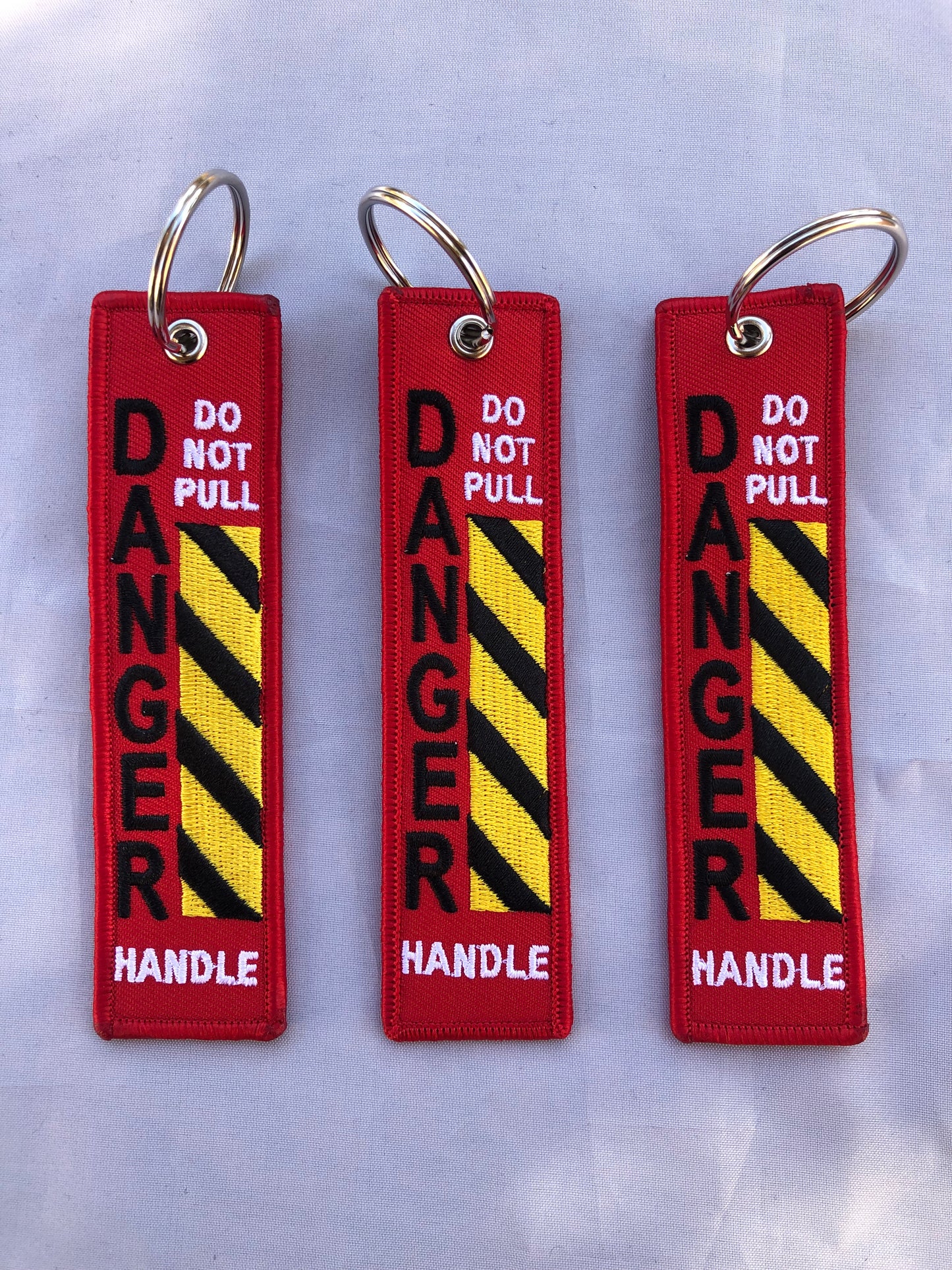 Do Not Pull Handle Danger Keychain Set Of 3
