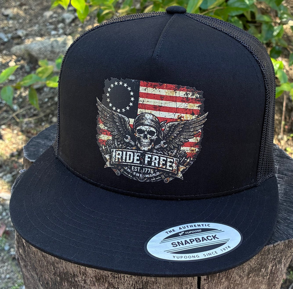 Ride Free flat bill hat — actual product photo, front three-quarter view